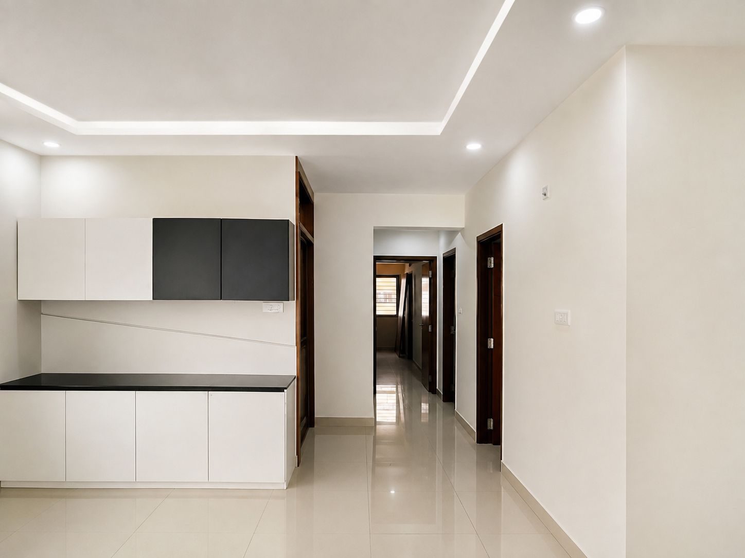 Hallway with overhead cabinetry